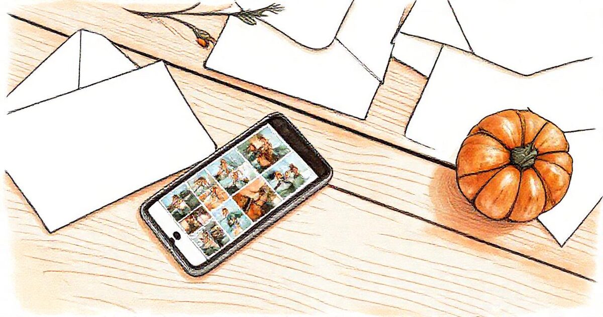 A sketch of a phone showing a grid of photos, lying on a wooden table beside holiday cards, an envelope and a small pumpkin