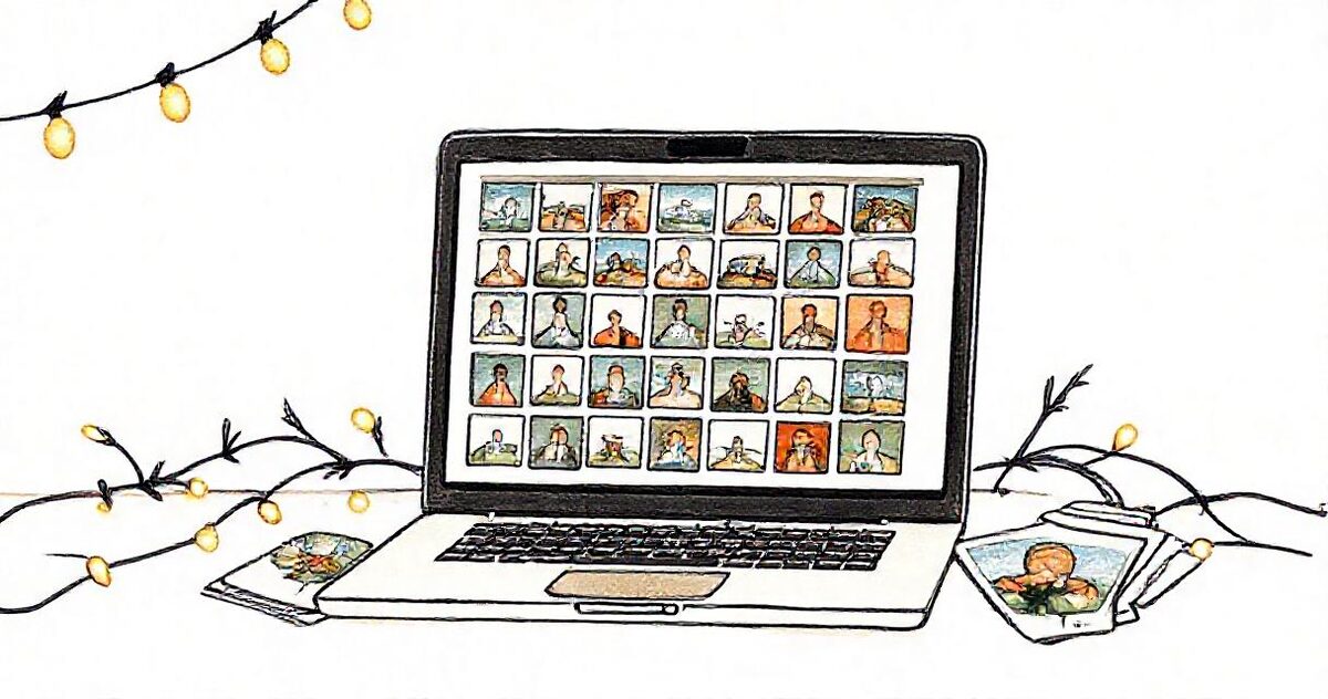 A laptop showing many small photo galleries in a grid, with holiday cards fanned out beside it and string lights
